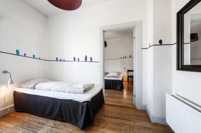 Postel nebo postele na pokoji v ubytování Hotel Saxkjøbing
