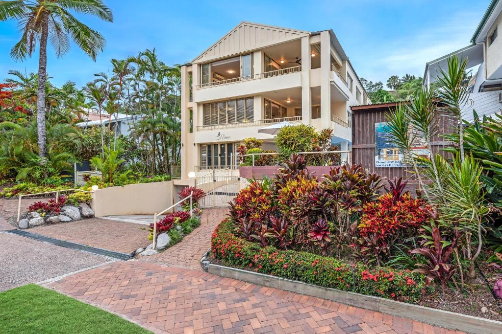 a house with a garden in front of it at Silkari Reflections of Port Douglas in Port Douglas