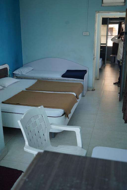 Postel nebo postele na pokoji v ubytování Hotel Rajesh