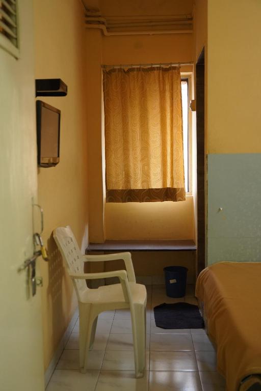 Postel nebo postele na pokoji v ubytování Hotel Rajesh