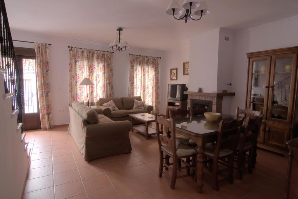 a living room with a couch and a table at Casa Concepción in Grazalema
