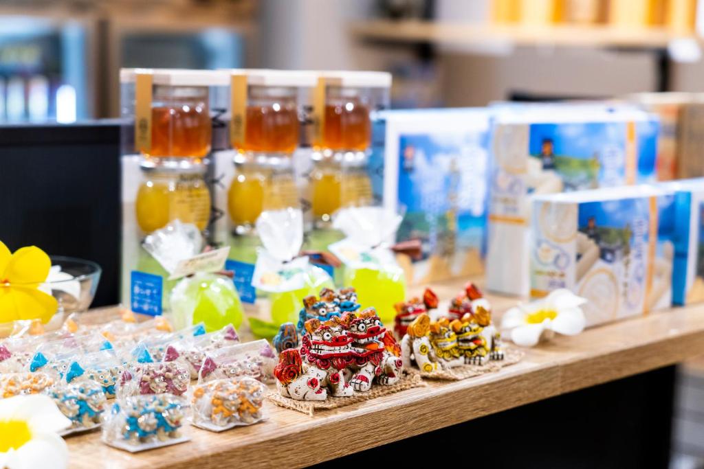 a table with cookies and other desserts on it at Hotel Torifito Miyakojima Resort in Miyako-jima