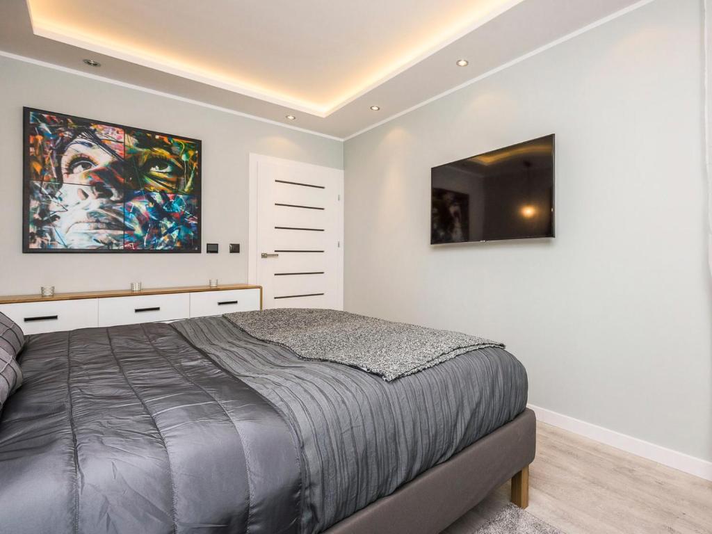 Posteľ alebo postele v izbe v ubytovaní COMFORT INN APARTMENTS - Gdansk, Sadowa