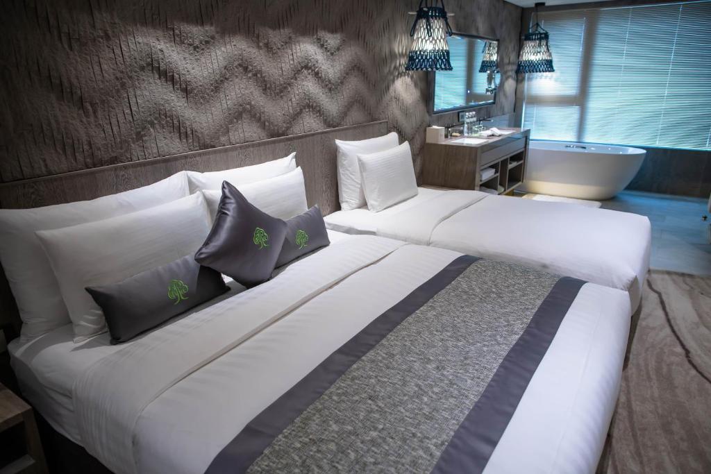 Postel nebo postele na pokoji v ubytování arTree hotel