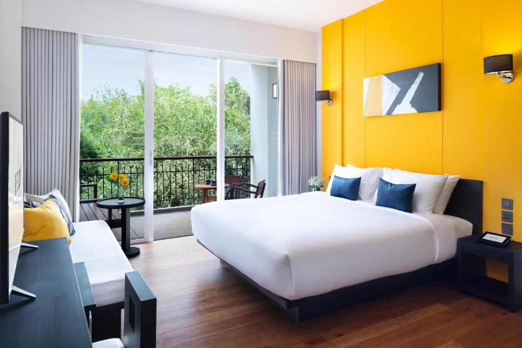 Postel nebo postele na pokoji v ubytování RELO' The Urban Escape - Huahin