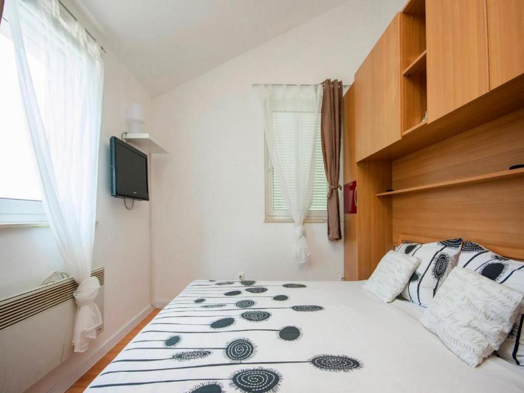Кровать или кровати в номере Deluxe Apartment Toni