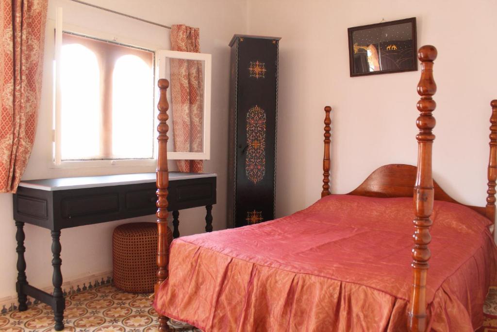 Una cama o camas en una habitación de Complexe touristique FORT BOU-JERIF
