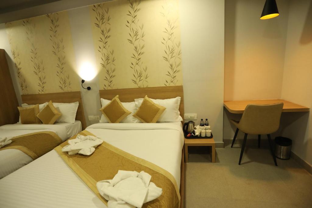 Postel nebo postele na pokoji v ubytování VIPs Hotel Olive
