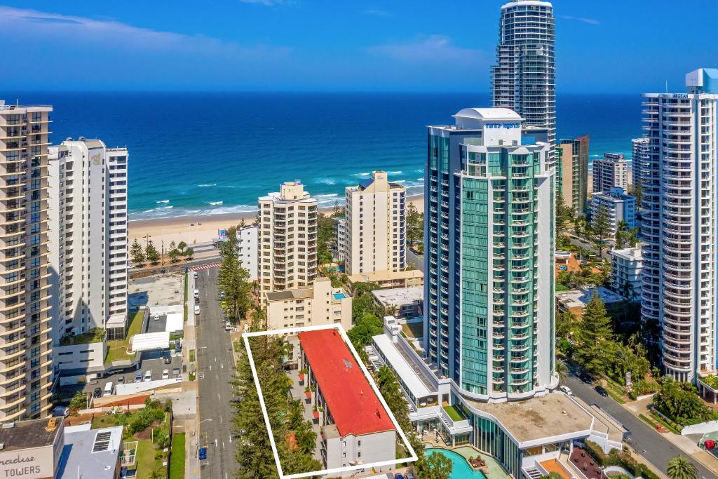 an aerial view of a city with a beach and buildings at Surfers Paradise- meters from the beach! in Gold Coast