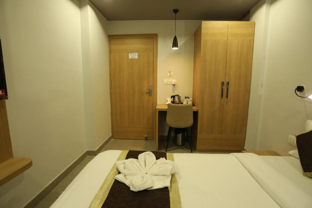 Postel nebo postele na pokoji v ubytování VIPs Hotel Olive