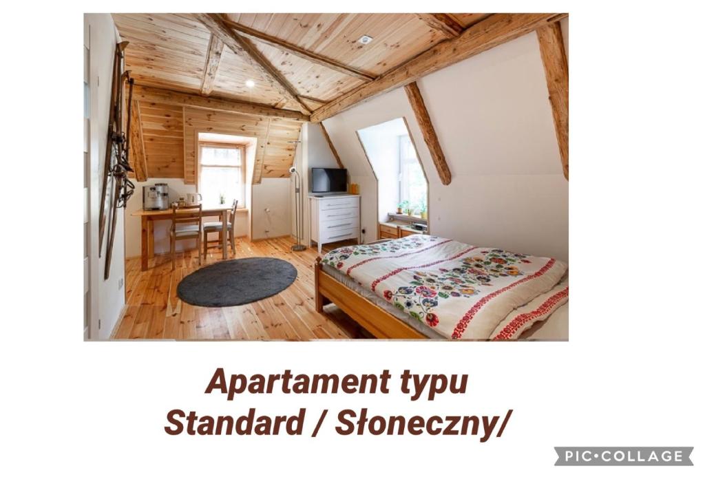 Łóżko lub łóżka w pokoju w obiekcie Apartamenty Pod Skocznią