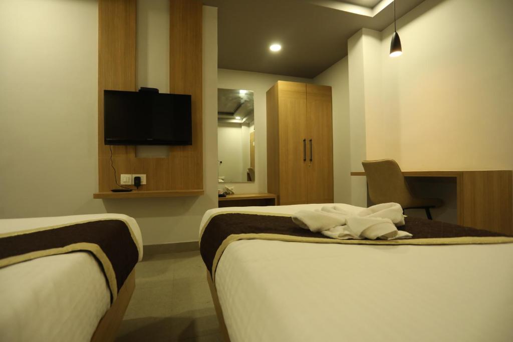 TV a/nebo společenská místnost v ubytování VIPs Hotel Olive