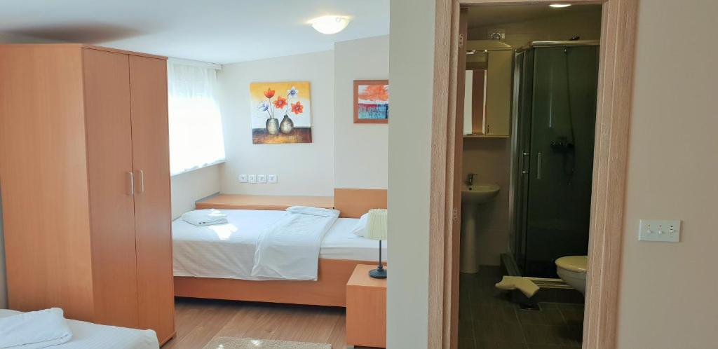 Postel nebo postele na pokoji v ubytování Hotel Topcider