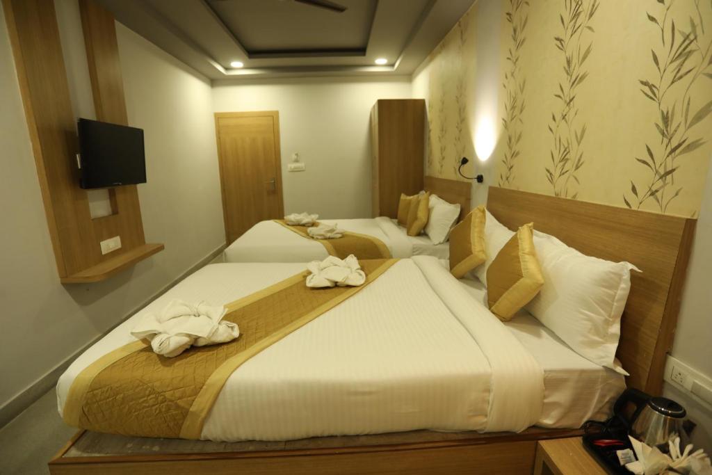 Postel nebo postele na pokoji v ubytování VIPs Hotel Olive