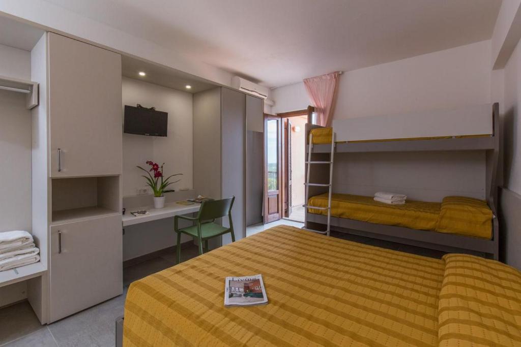Postel nebo postele na pokoji v ubytování Hotel Ispinigoli