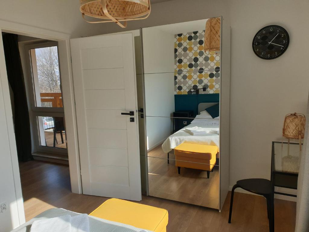 Posteľ alebo postele v izbe v ubytovaní Apartament Zielony