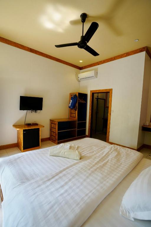 Postel nebo postele na pokoji v ubytování Veli Beach Inn
