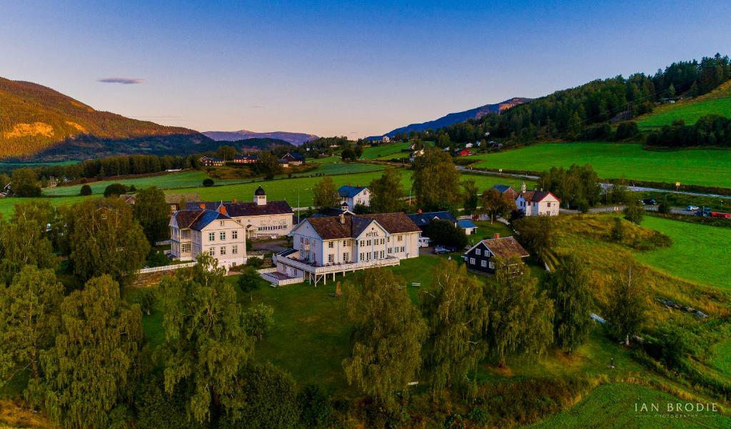 an aerial view of a large house in a field at Dale-Gudbrands Gard Kurs & Konferansesenter in Sør-Fron