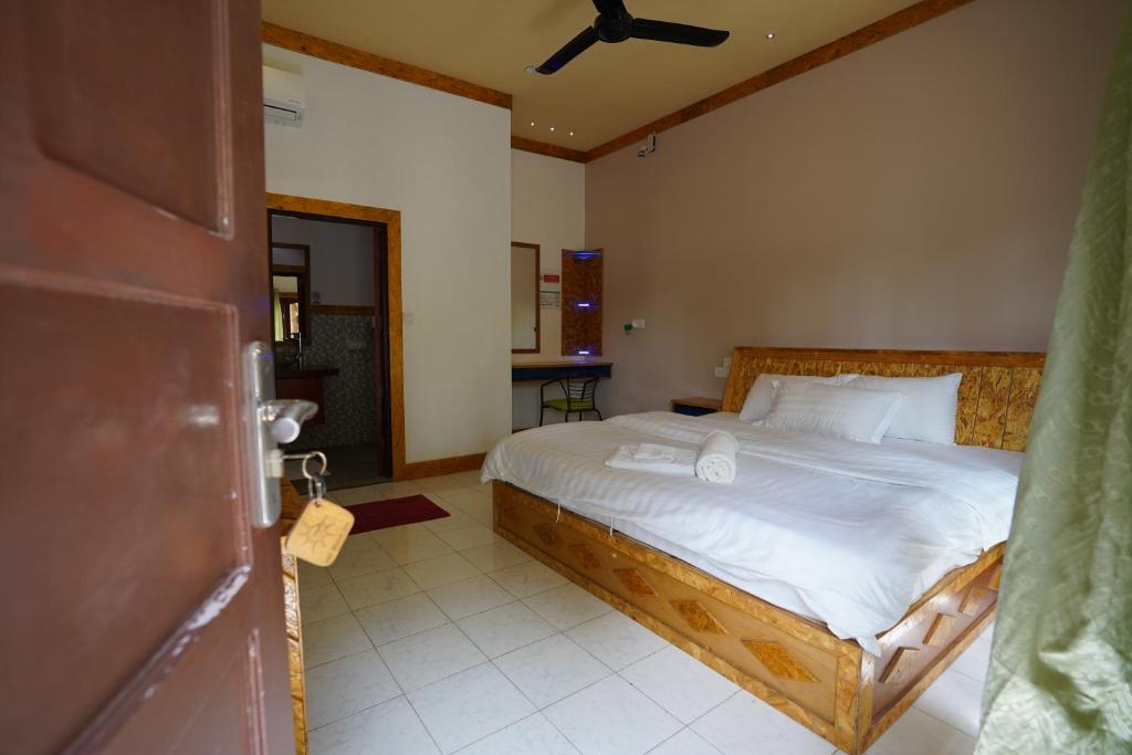 Postel nebo postele na pokoji v ubytování Veli Beach Inn