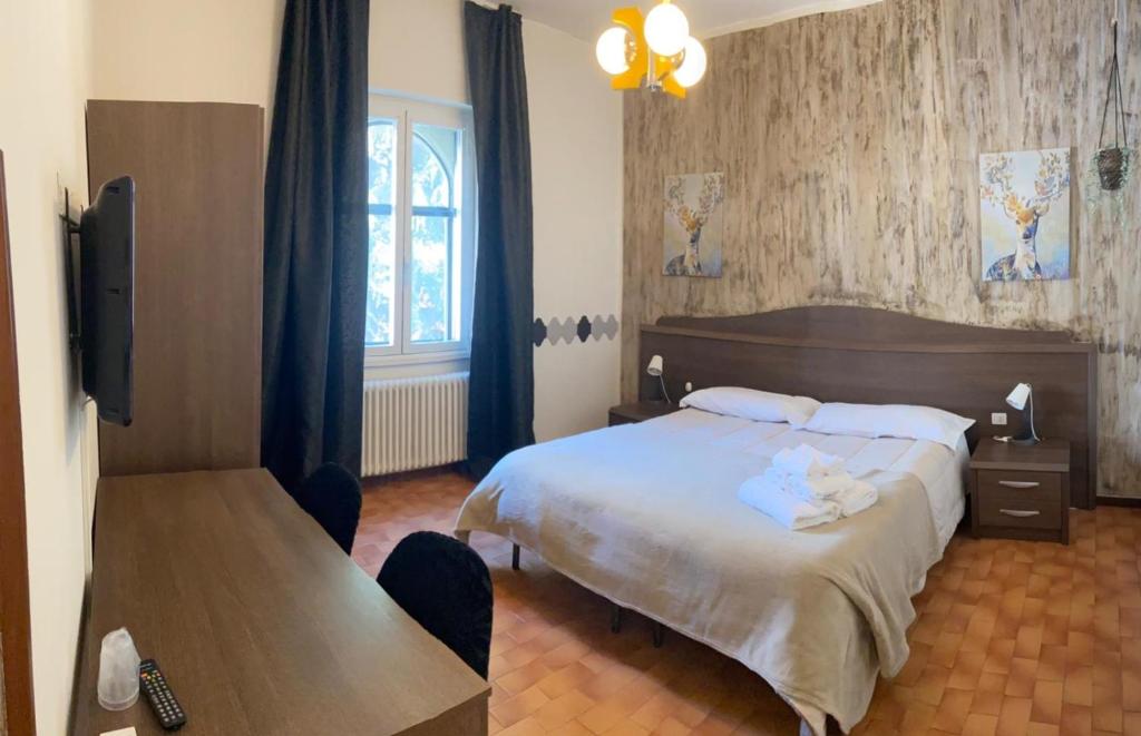 Postel nebo postele na pokoji v ubytování ALBERGO 900Strati