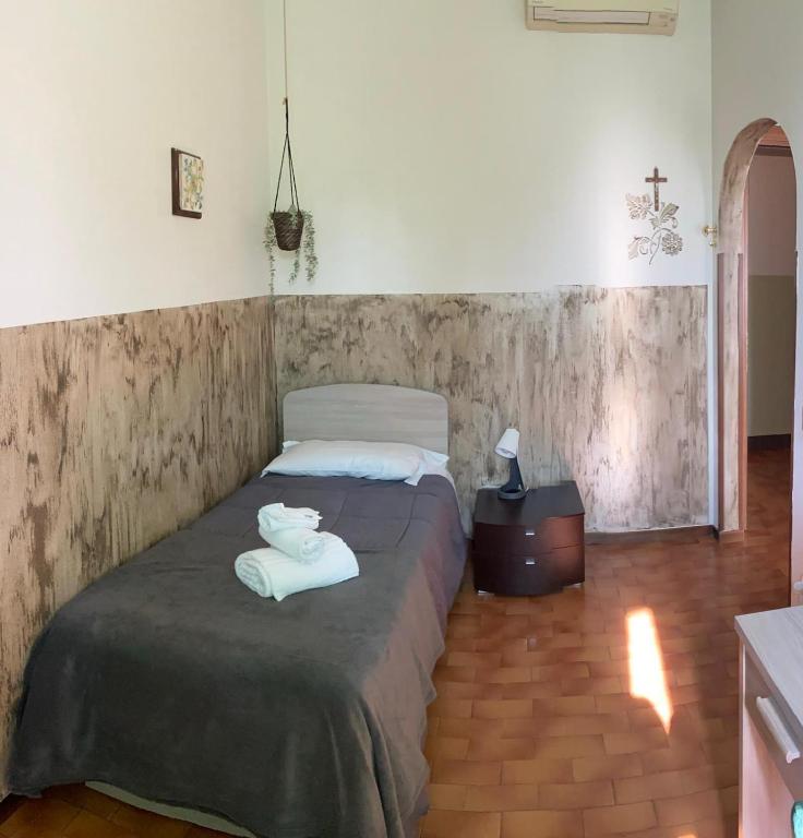 Postel nebo postele na pokoji v ubytování ALBERGO 900Strati