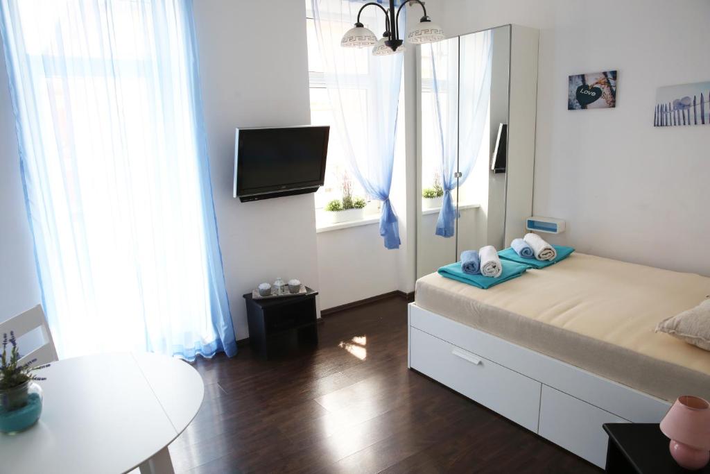 TV a/nebo společenská místnost v ubytování Villa mit Whirlpool für 32 Per