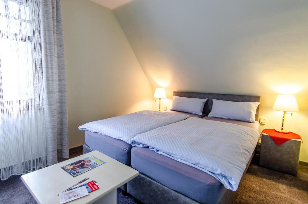 Postel nebo postele na pokoji v ubytování Hotel-Restaurant Ochsen