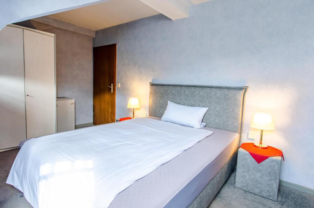Postel nebo postele na pokoji v ubytování Hotel-Restaurant Ochsen