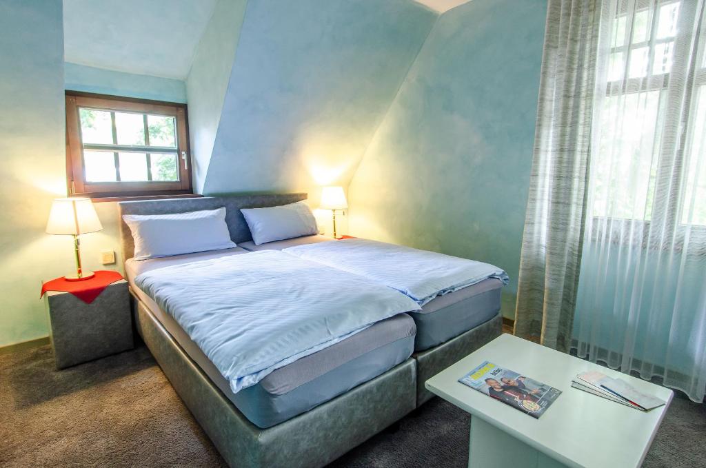 Postel nebo postele na pokoji v ubytování Hotel-Restaurant Ochsen