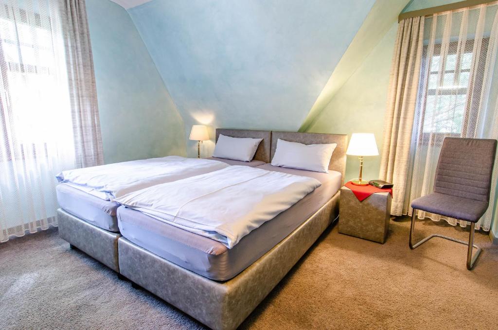 Postel nebo postele na pokoji v ubytování Hotel-Restaurant Ochsen
