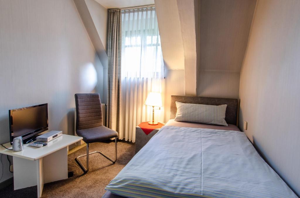 Postel nebo postele na pokoji v ubytování Hotel-Restaurant Ochsen