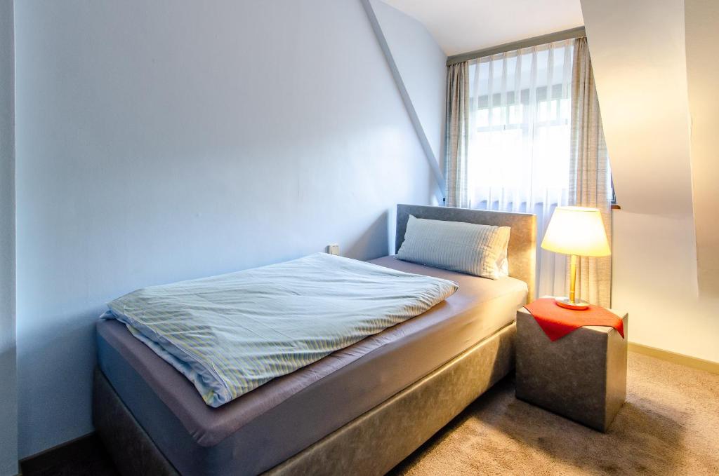 Postel nebo postele na pokoji v ubytování Hotel-Restaurant Ochsen