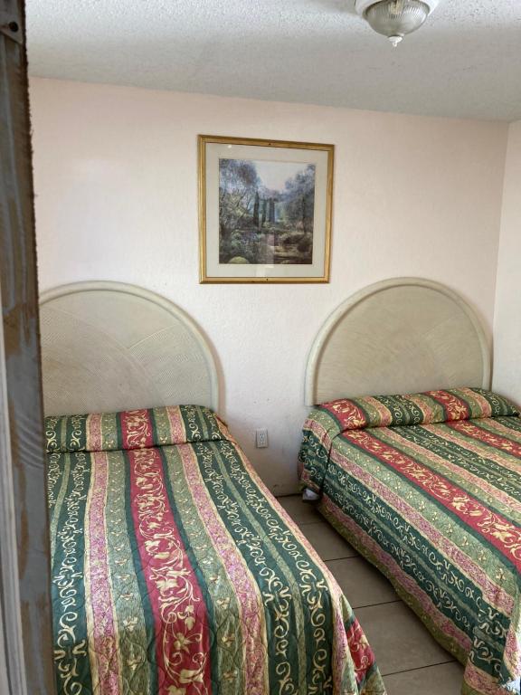 Postel nebo postele na pokoji v ubytování Surfside Motel - Seaside Heights