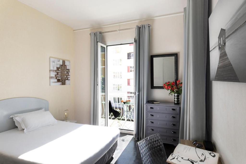 Postel nebo postele na pokoji v ubytování Hotel Marengo