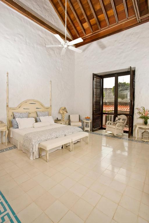 Postel nebo postele na pokoji v ubytování Hotel Casa Quero