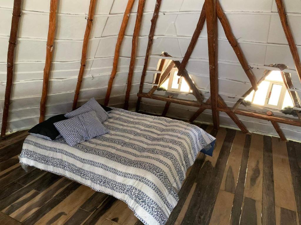 Postel nebo postele na pokoji v ubytování Chez Gigi - Eco Lodge