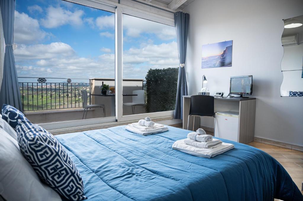 Posteľ alebo postele v izbe v ubytovaní Il Moro - Agrigento Rooms