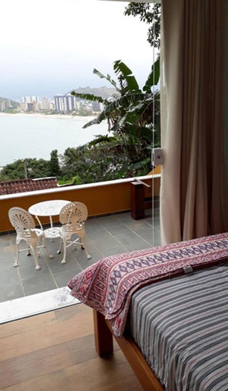  Honey Moon - Vista do mar na cama.