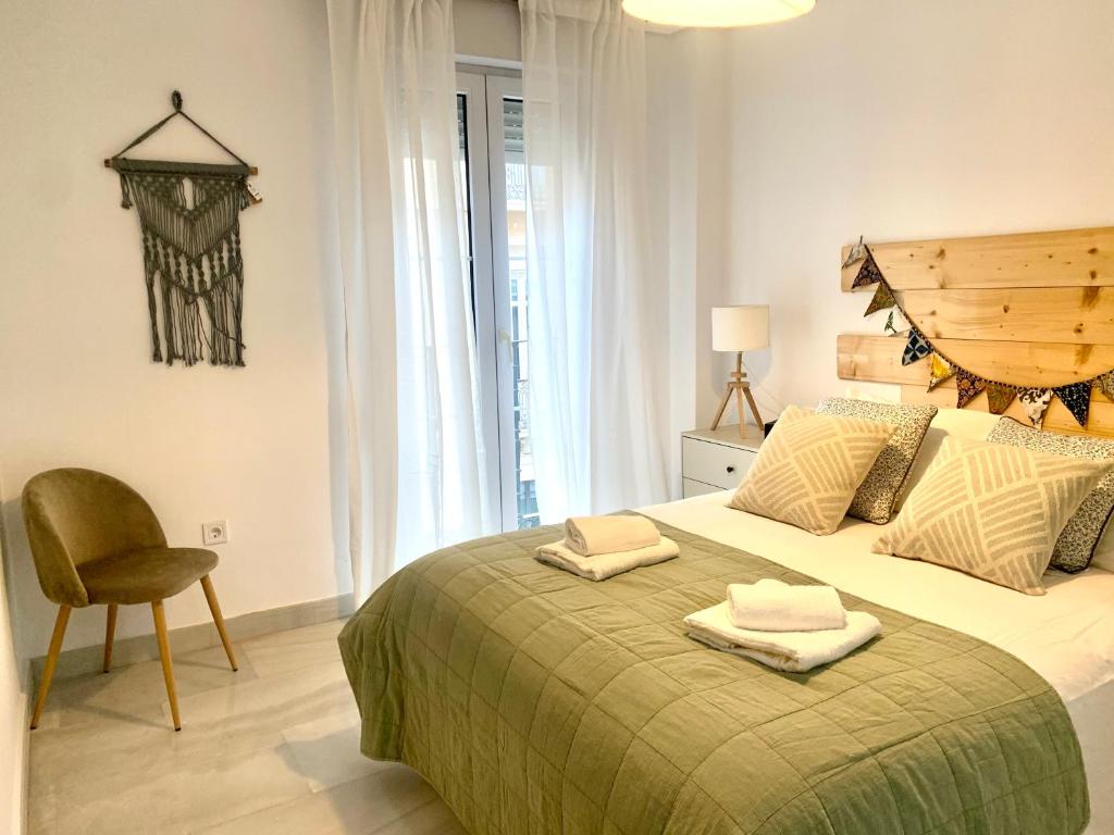 Posteľ alebo postele v izbe v ubytovaní Homely Málaga Larios