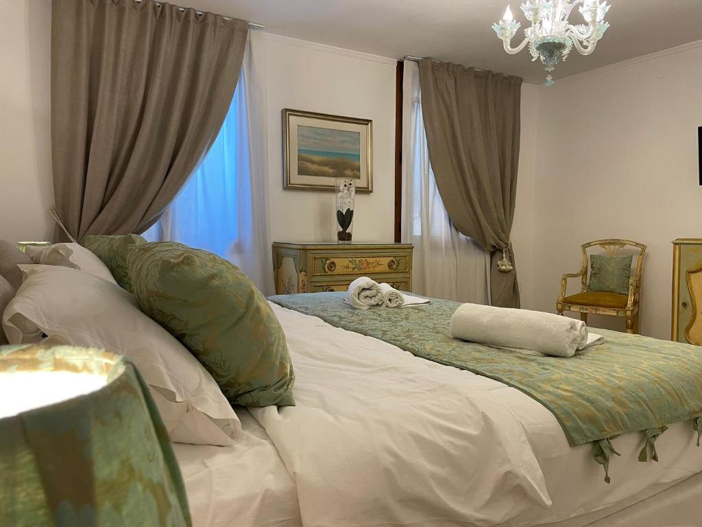 a bedroom with a bed with a dog laying on it at Riva De Biasio in Venice