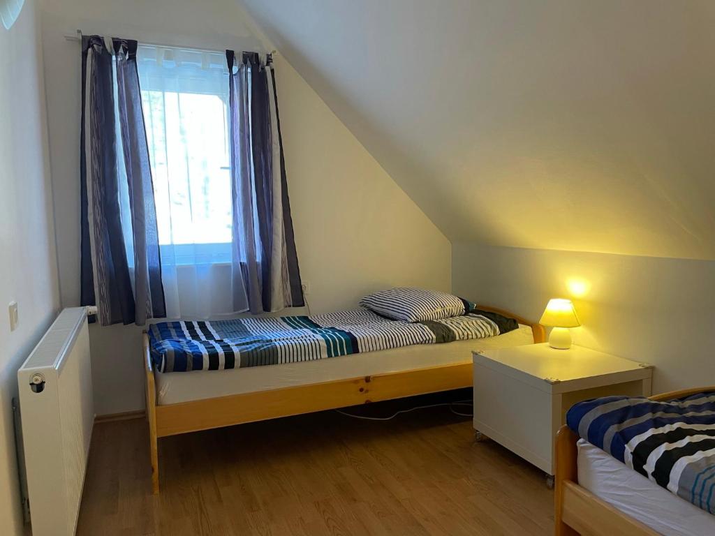 Postel nebo postele na pokoji v ubytování Martinov dom