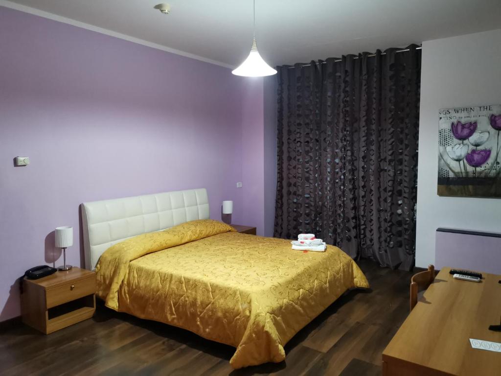 Postel nebo postele na pokoji v ubytování Hotel Park Grumentum