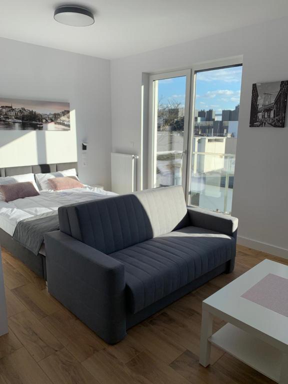 Posteľ alebo postele v izbe v ubytovaní Apartamenty Garbary 32 z klimatyzacja - air-conditioning
