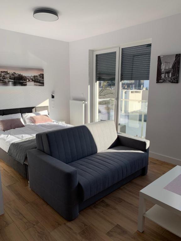 Posteľ alebo postele v izbe v ubytovaní Apartamenty Garbary 32 z klimatyzacja - air-conditioning