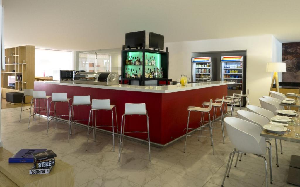 TV a/nebo společenská místnost v ubytování Fiesta Inn Leon