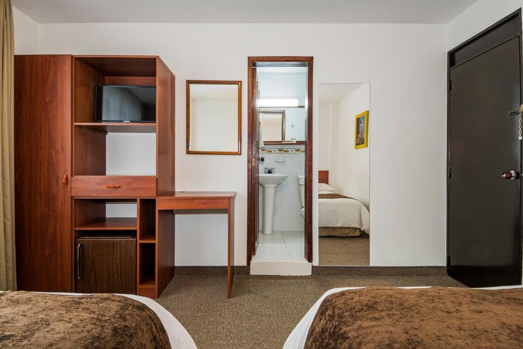 Postel nebo postele na pokoji v ubytování Hotel El Campin