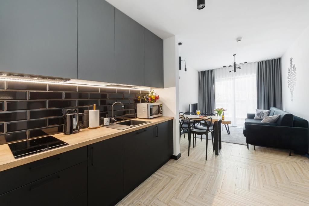 Kuchyňa alebo kuchynka v ubytovaní Apartament - Kluszkowce nad Jeziorem Czorsztyńskim