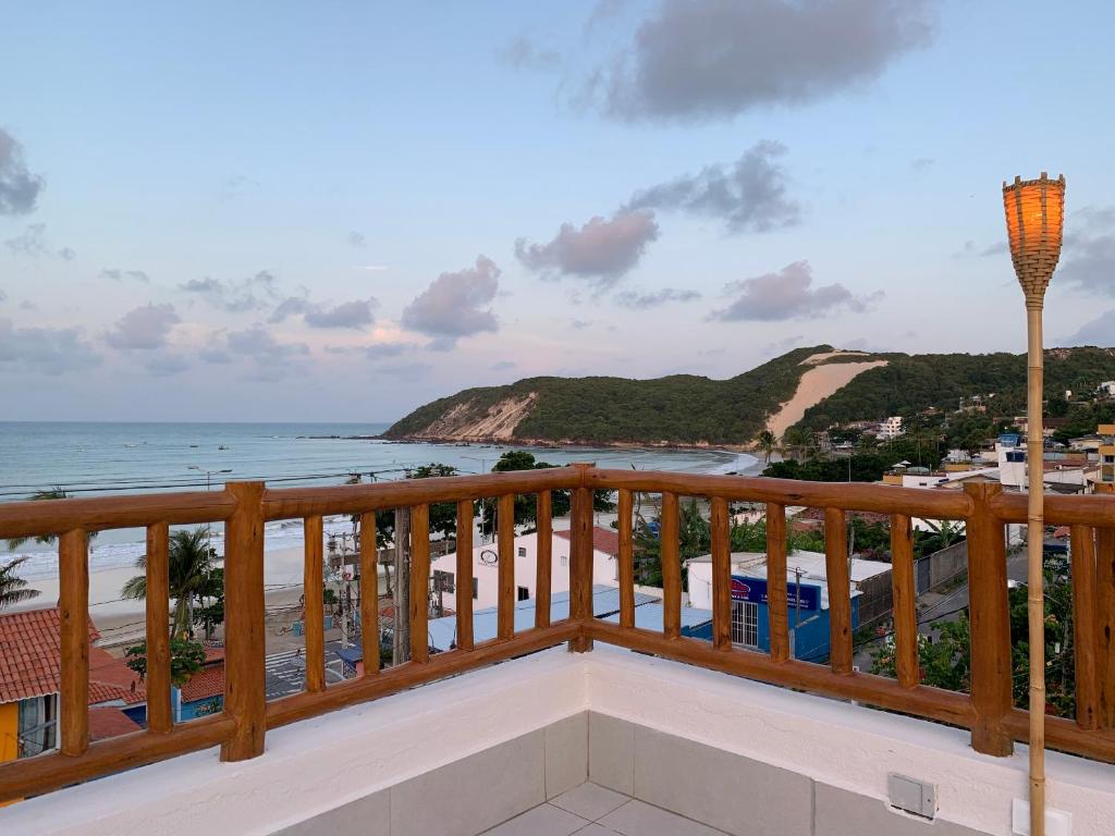 a balcony with a view of the beach at Swell Praia Hotel in Natal