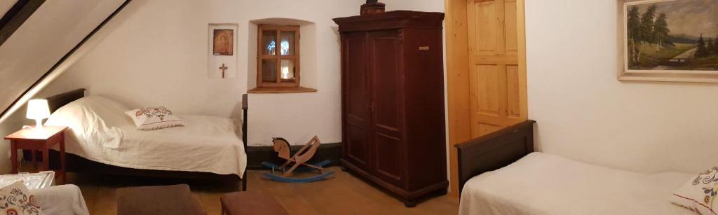 Postel nebo postele na pokoji v ubytování Apartmány U sv. Floriána