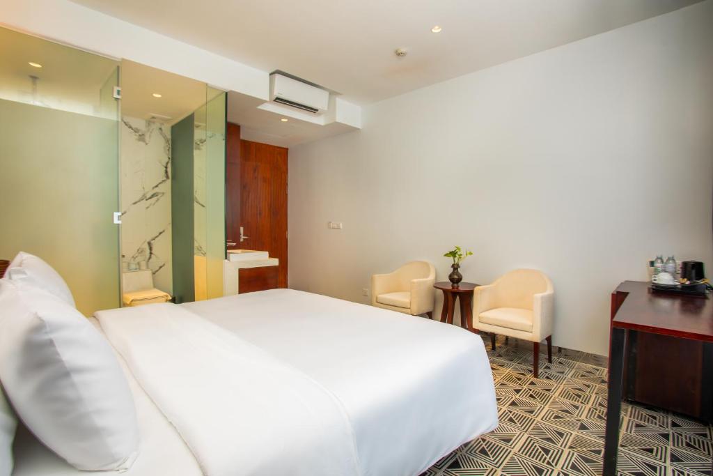 Postel nebo postele na pokoji v ubytování UTEY Hotel